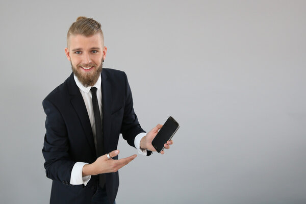 Young businessman using smartphone