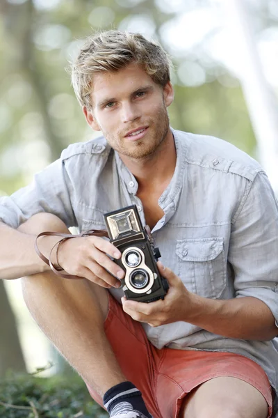 Trendy photographer using vintage camera — Stock Photo, Image