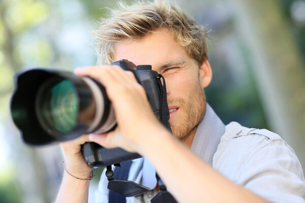 Photographer shooting with digital camera