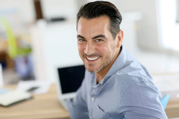 Businessman sitting in office — Stock Photo, Image