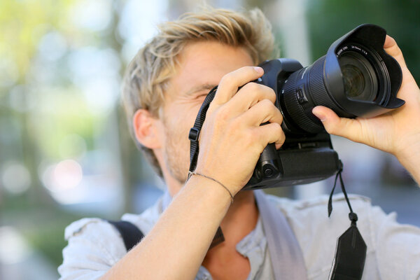 Photographer shooting with digital camera