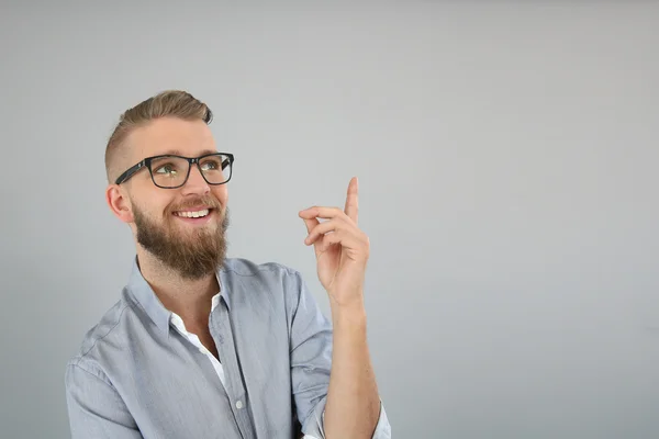 Trendy guy pointing at message — Stock Photo, Image