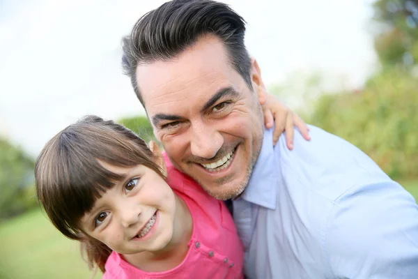 Little girl hugging her daddy — Stock Photo, Image