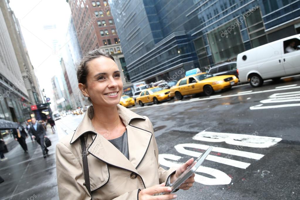 Businesswoman in Manhattan with tablet
