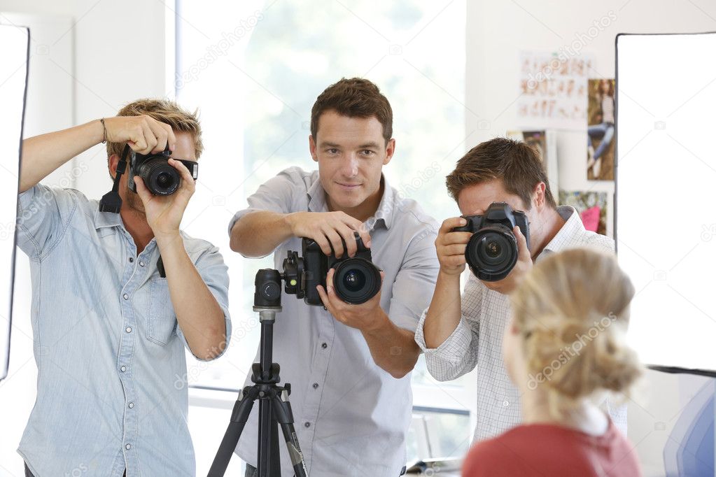 Photographers in studio with model