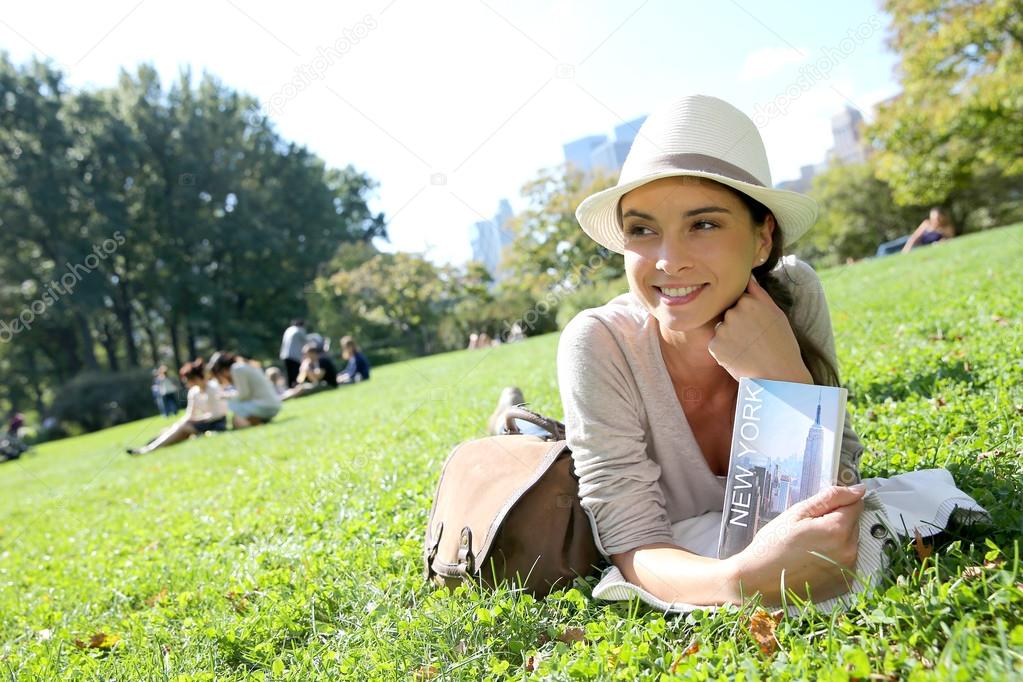 Woman reading New York city guide