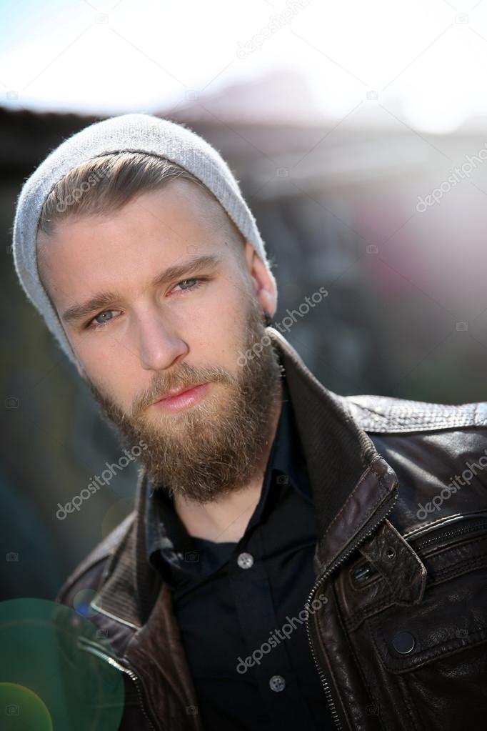 Stylish guy with beard in street