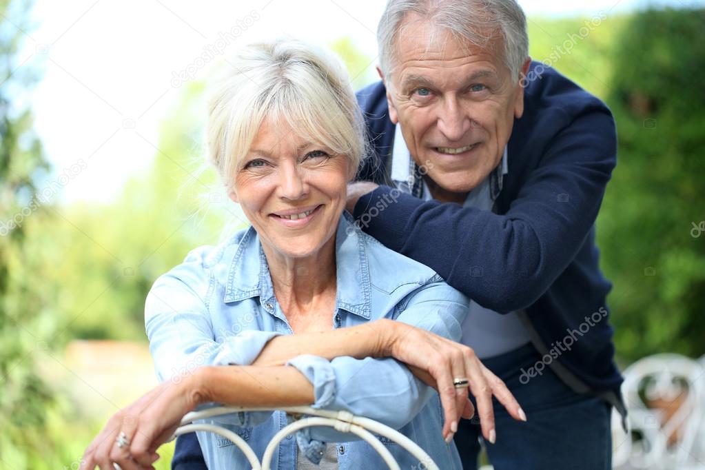 Senior couple in home garden