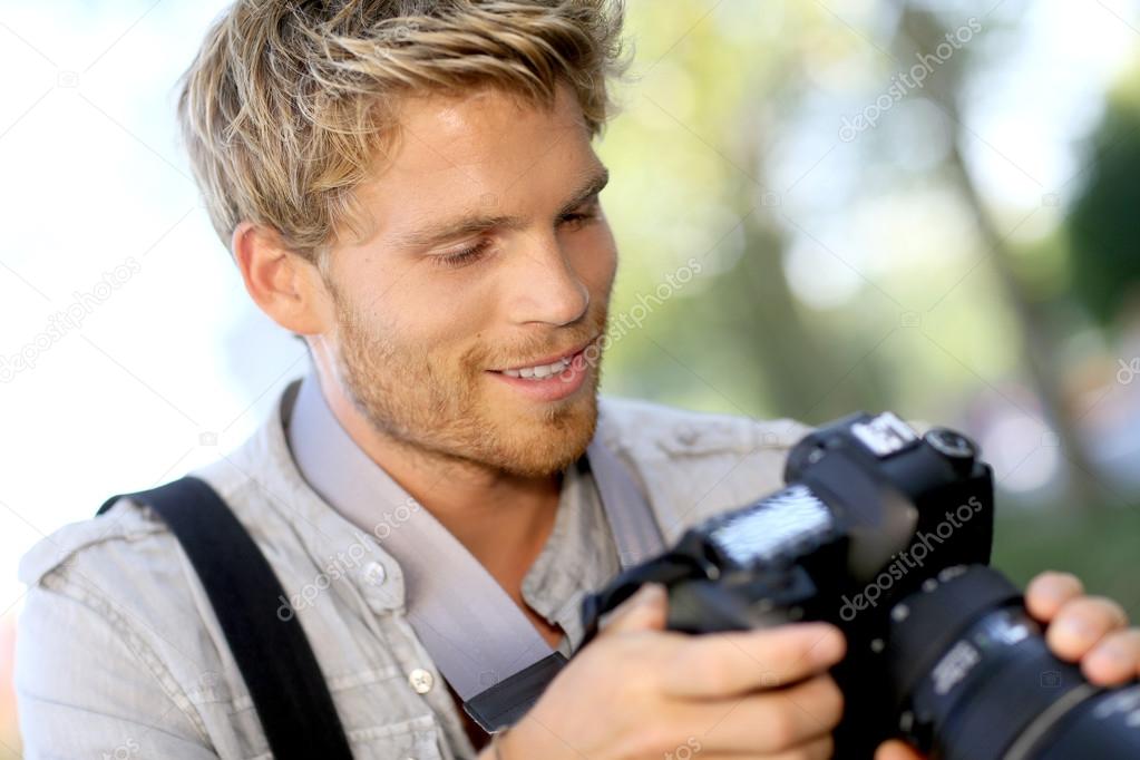Photographer checking shots on camera