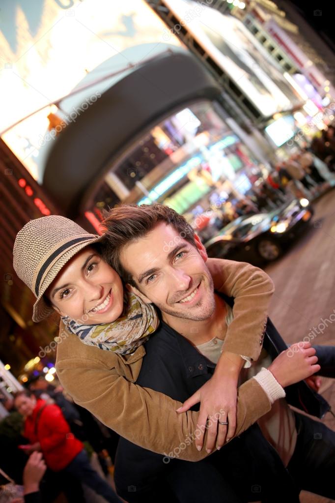 Couple standing in Time Square