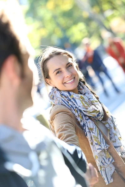 Girl pulling boyfriend by arm — Stock Photo, Image