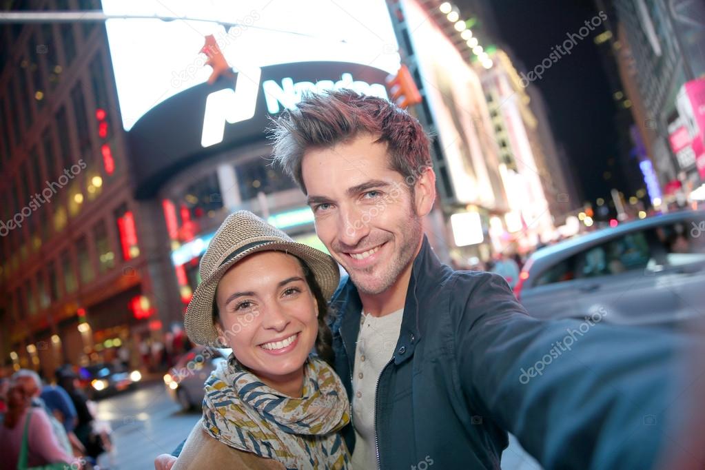 Couple standing in Time Square