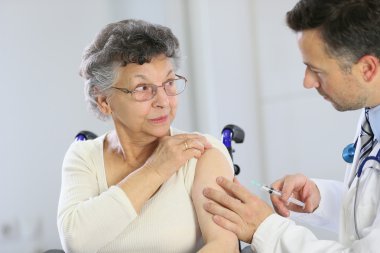 Doctor doing vaccine injection clipart