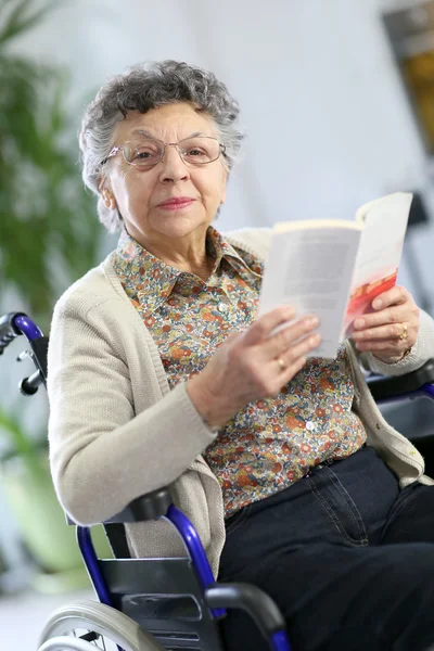 Elderly woman in wheelchair — Stock Photo, Image