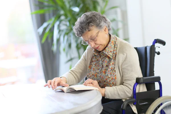 Elderly woman in wheelchair — Stock Photo, Image