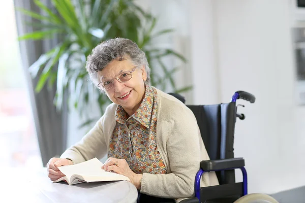 Elderly woman in wheelchair — Stock Photo, Image