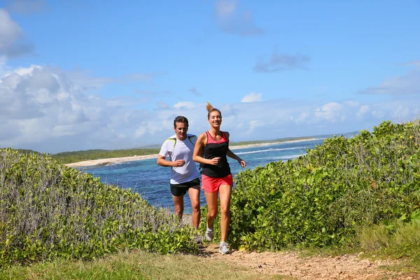 Couple running on track — Stock Photo, Image