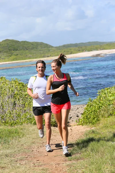 Couple running on track — Stock Photo, Image