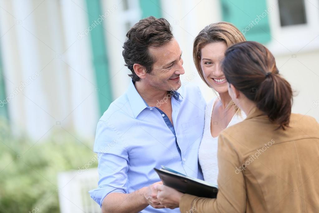 Couple meeting real-estate agent
