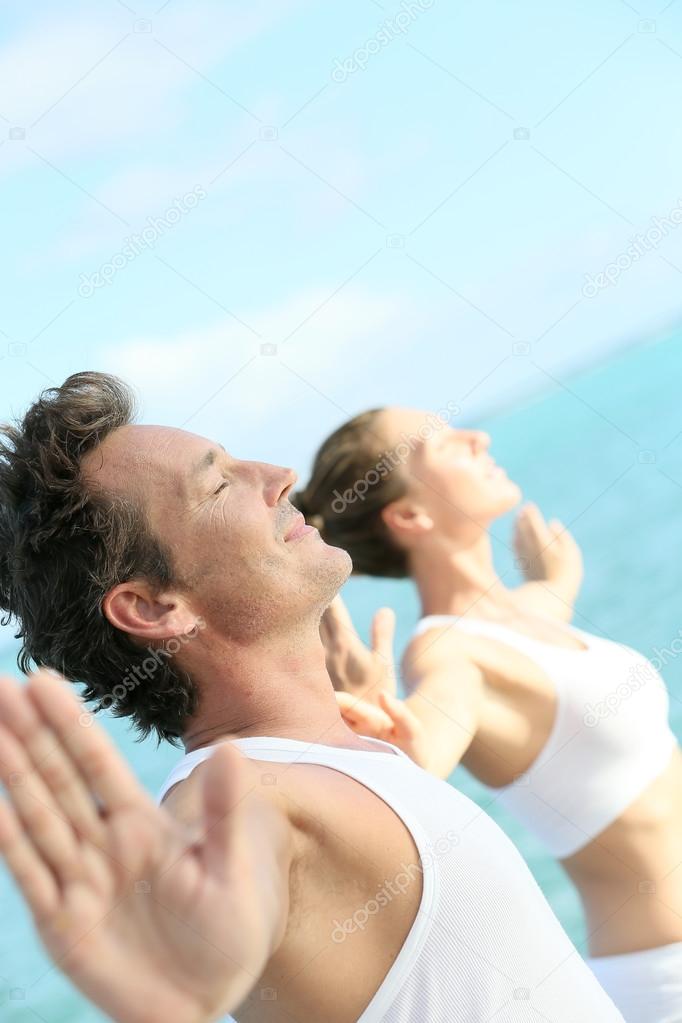 Couple doing relaxation exercises