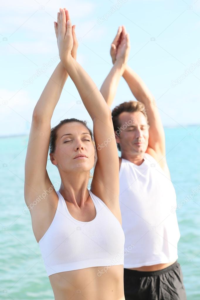 Couple doing yoga exercises