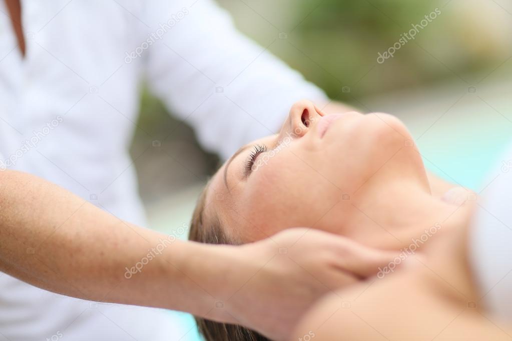 Woman receiving face massage