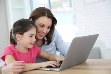 Mother and daughter doing homework clipart