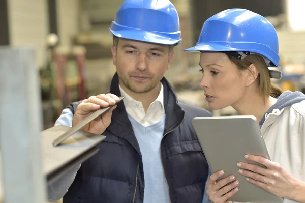 Supplier with engineer checking on production — Stock Photo, Image