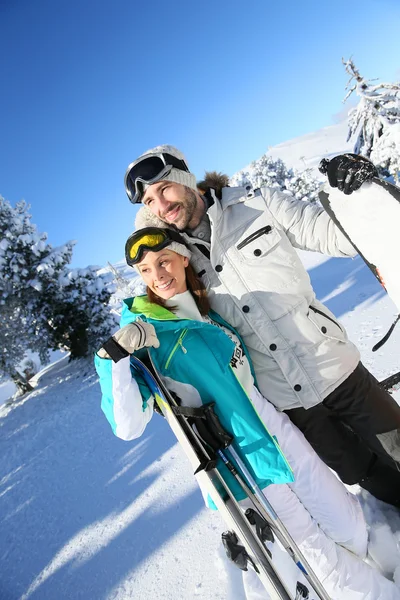 Skiers looking at snowy scenery — Stock Photo, Image