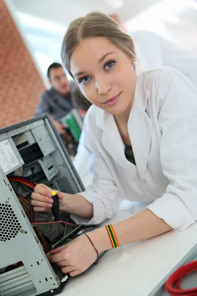 Student girl fixing computer — Stock Photo, Image