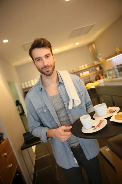 Waiter in coffee shop — Stock Photo, Image