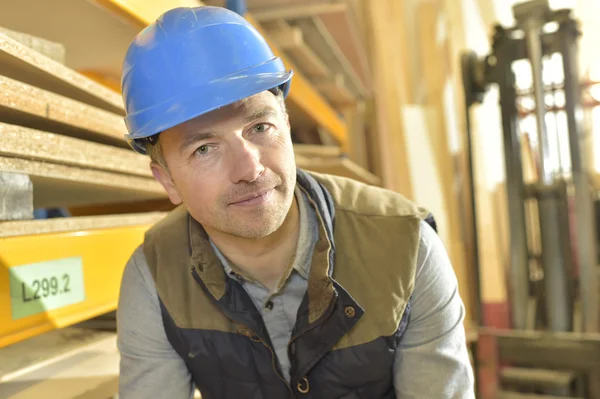 Smiling operator in warehouse — Stock Photo, Image