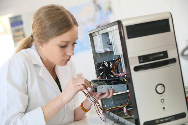 Girl fixing computer hard drive — Stock Photo, Image