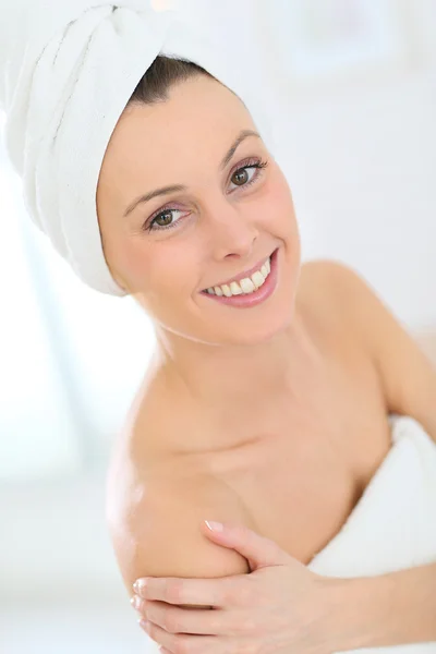 Woman with towel on hair Stock Photo