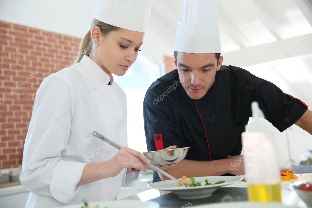 Girl in cooking class with chef