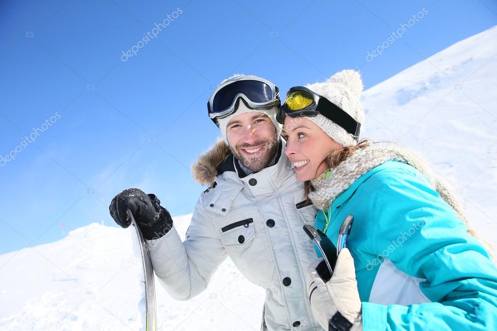 Couple of skiers at ski slope
