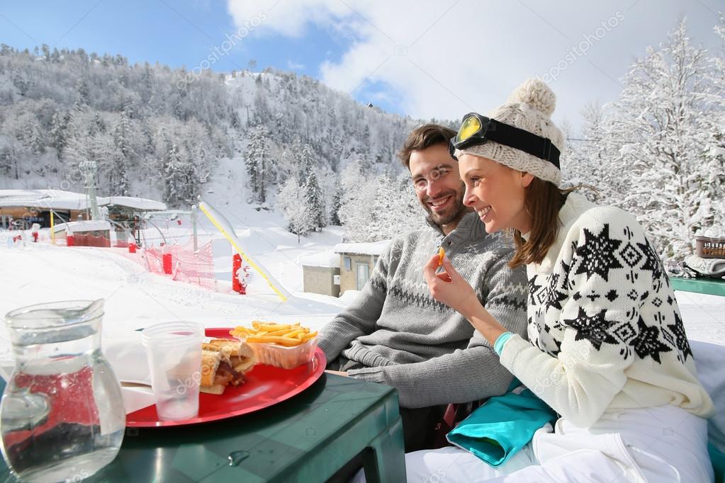 Skiers having snack