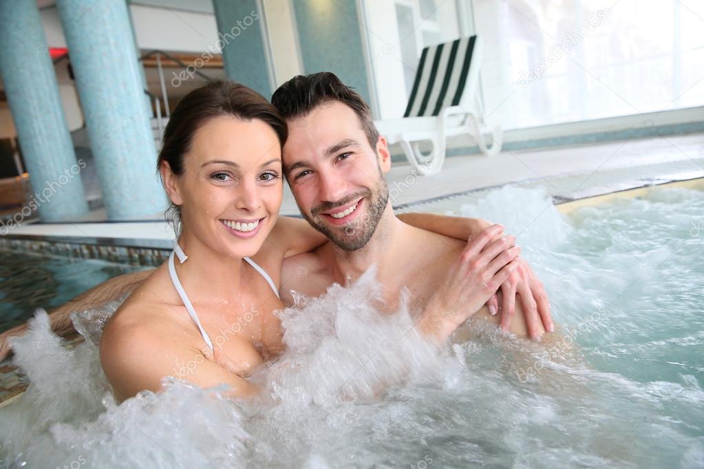 Couple in spa center jacuzzi