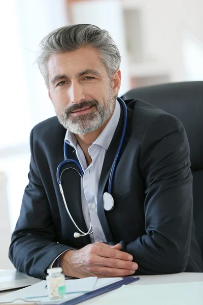 Mature doctor in office — Stock Photo, Image