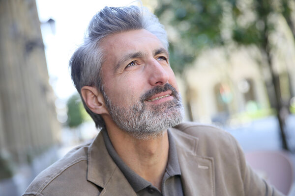 Man sitting on public bench