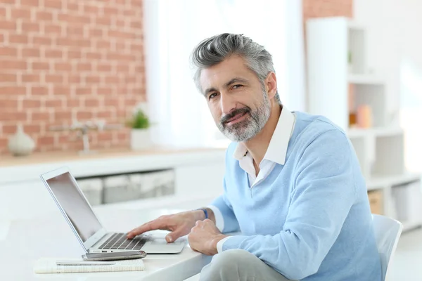 Businessman working from home with laptop — Stock Photo, Image