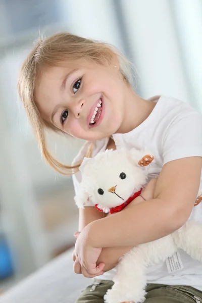 Girl hugging teddy — Stock Photo, Image