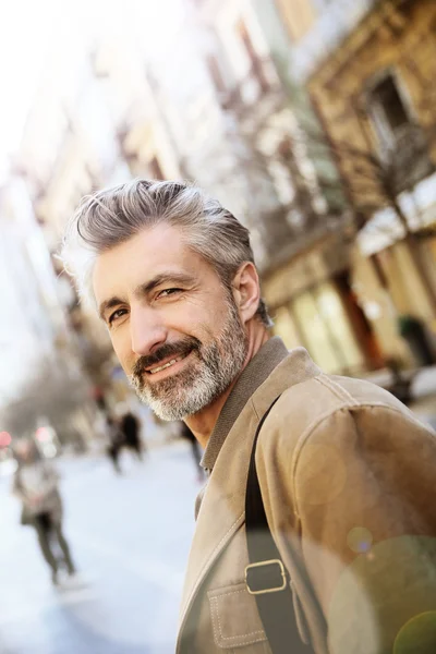 Man walking in town — Stock Photo, Image