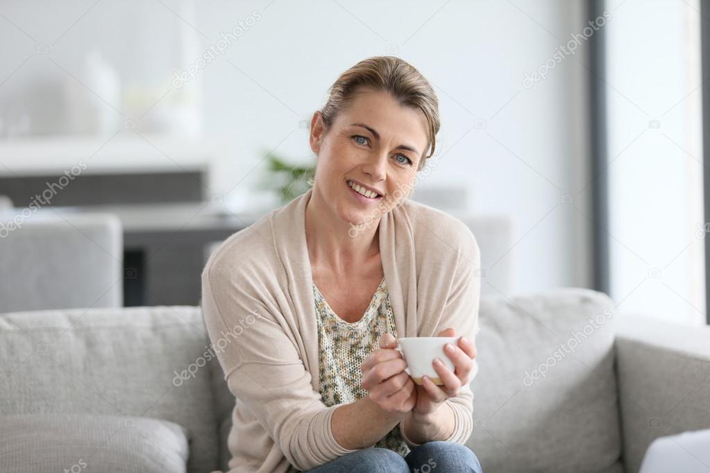 Woman holding cup of coffee