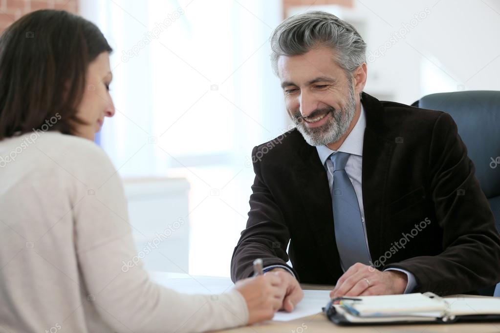 Attorney meeting client in office