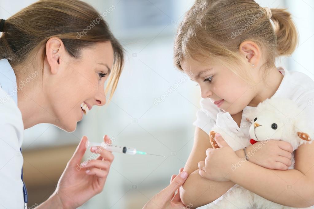 Girl receiving injection