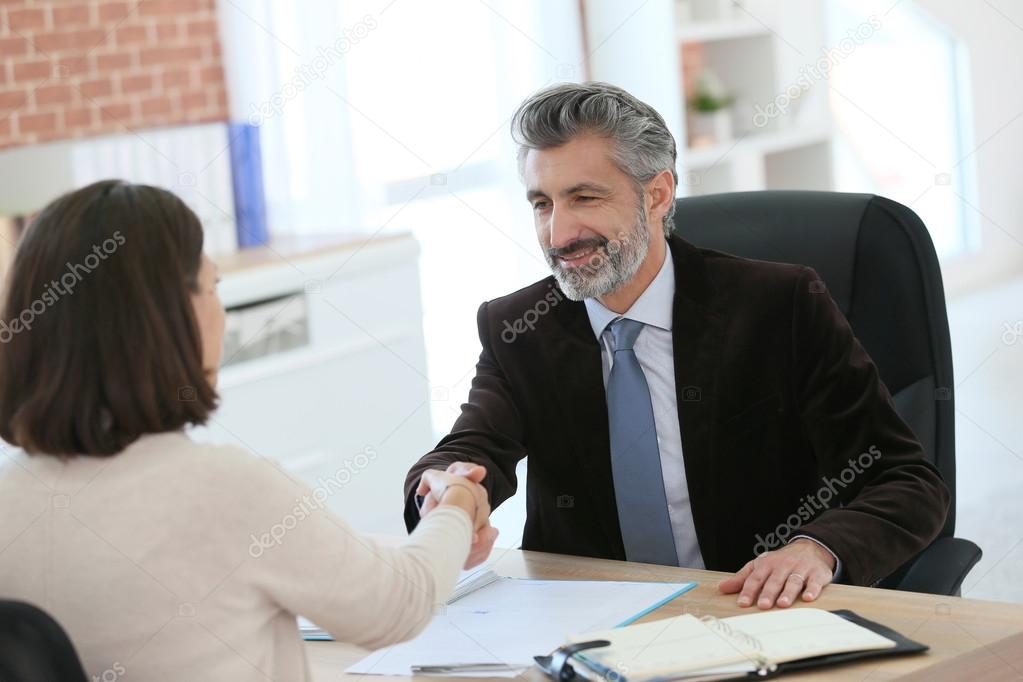 Attorney shaking hand to client
