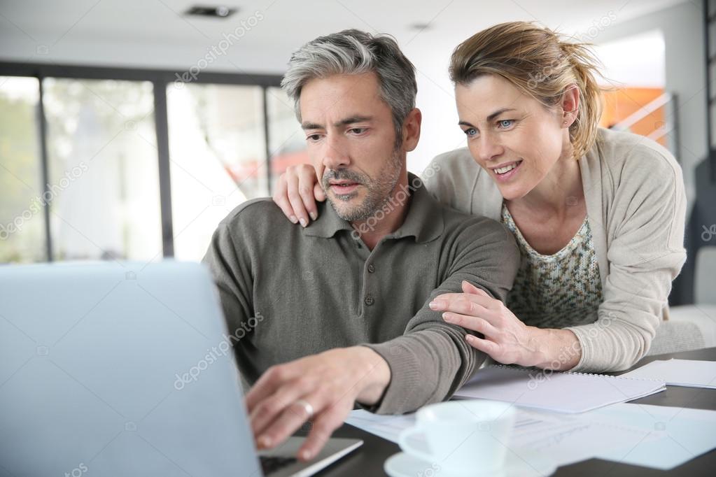 Couple calculating financial savings