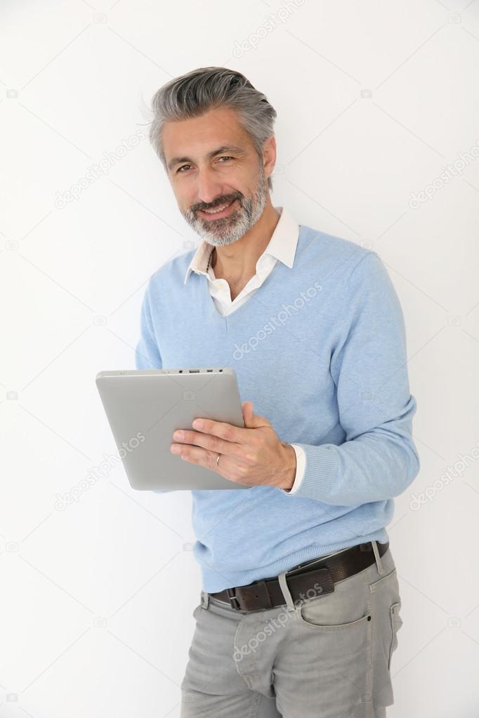 Man websurfing with tablet