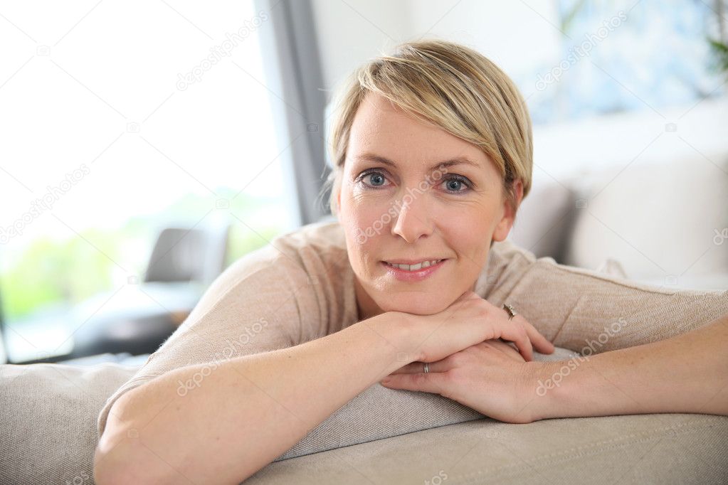 Woman relaxing on sofa